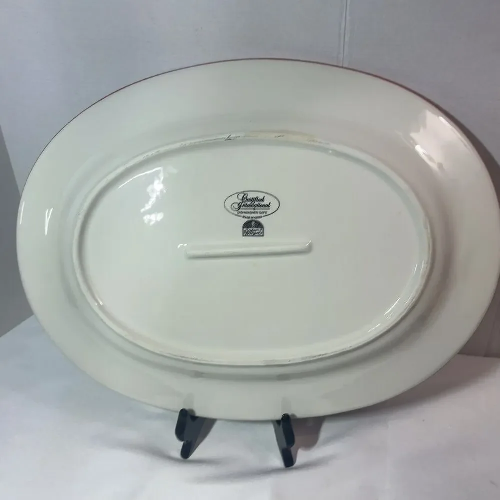 Certified International Enchanted Santa Oval Serving Platter 14x10 in Red